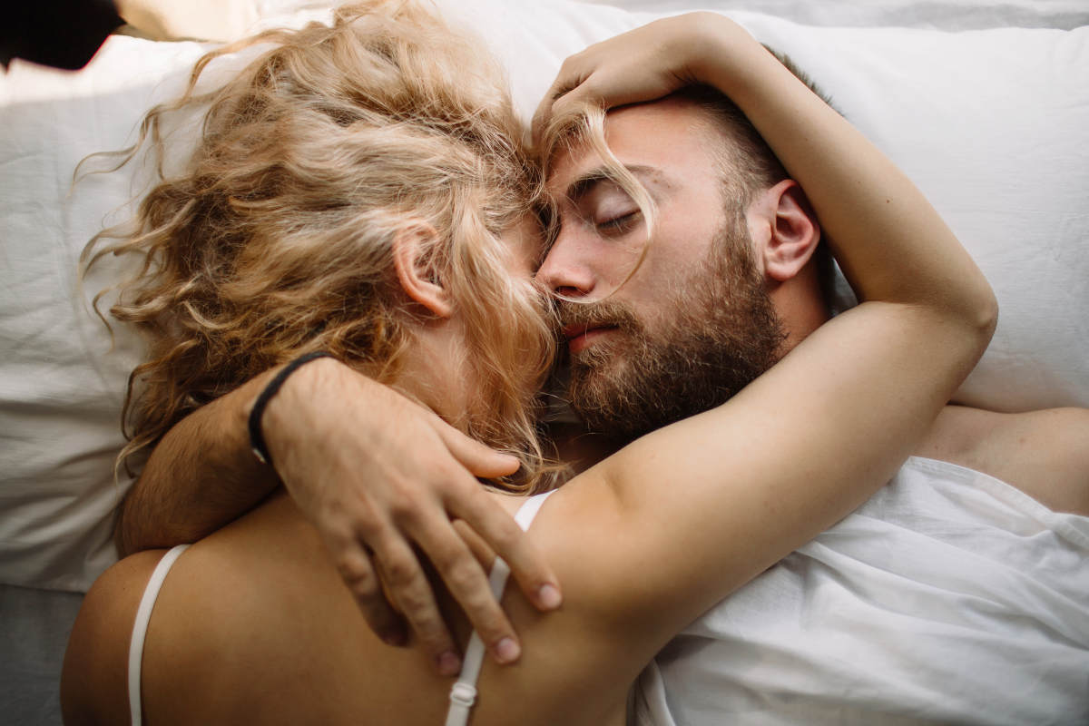 Pretty loving couple luxurating in bed together | Is Your Vagina Depressed? Symptoms of Vulvodynia and How To Treat It