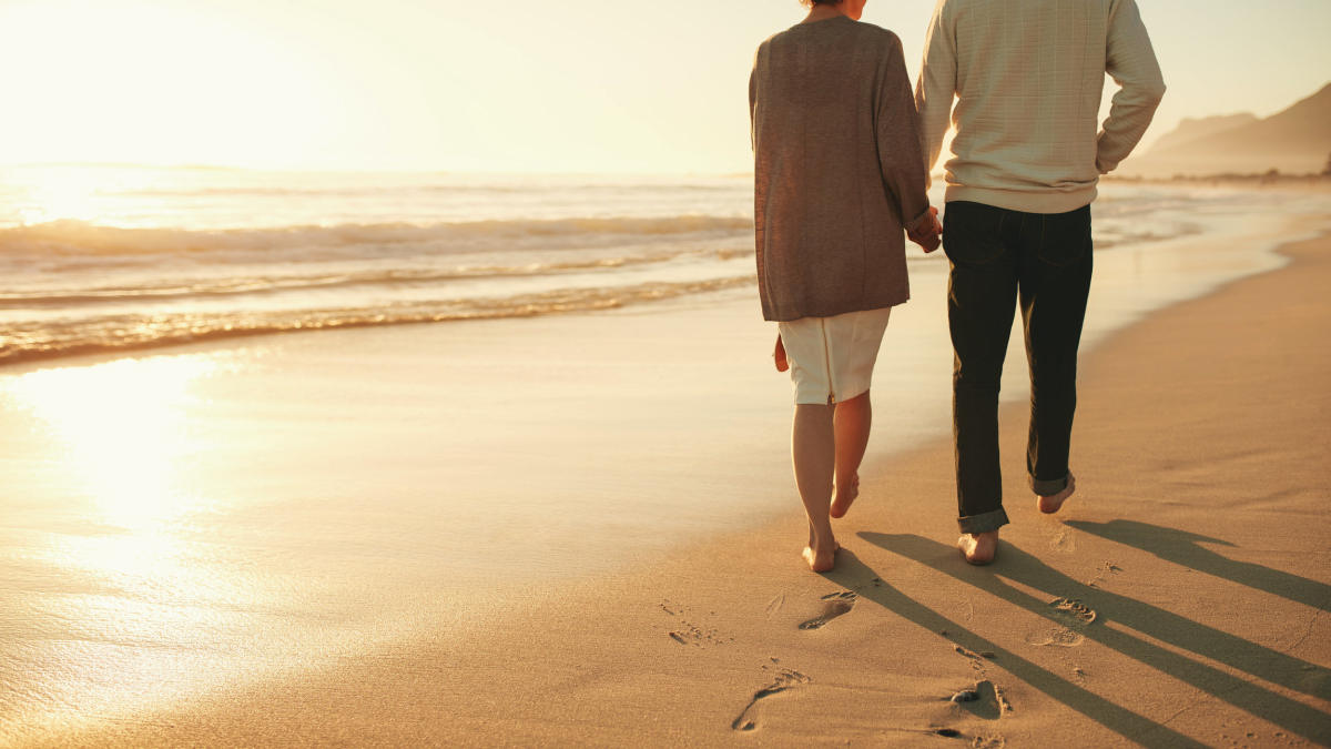 Rear view cropped shot of a senior couple holding hands | How Regular Sex Can Strengthen a Relationship
