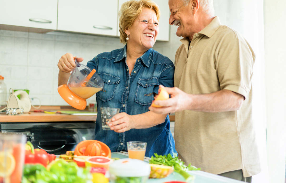 Happy senior couple preparing healthy vegetarian breakfast | How to Keep The Flame Alive In Your Senior Years