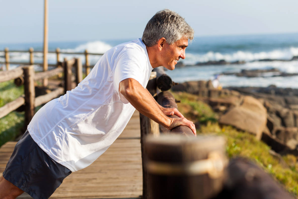 Fit senior man exercising at the beach in the morning | How to Keep The Flame Alive In Your Senior Years