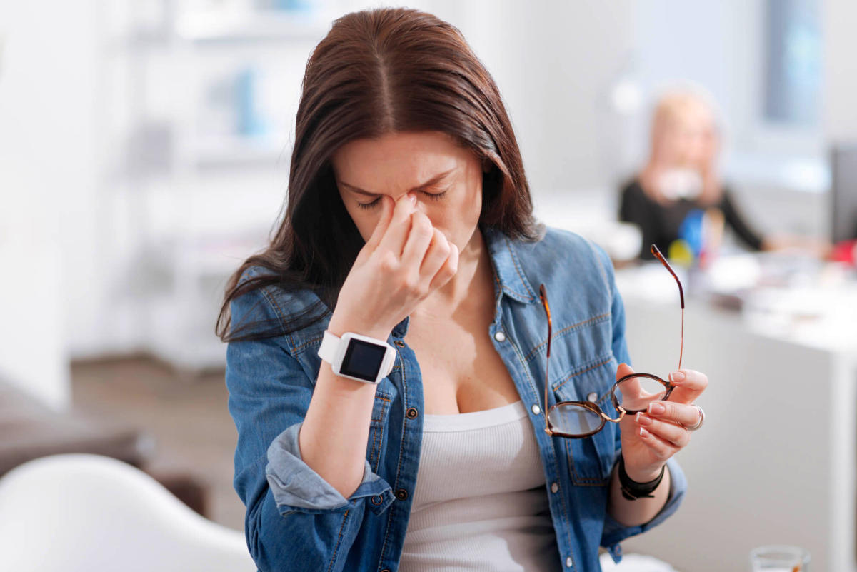 Unhappy hardworking woman feeling tired | Signs That You Are In Menopause