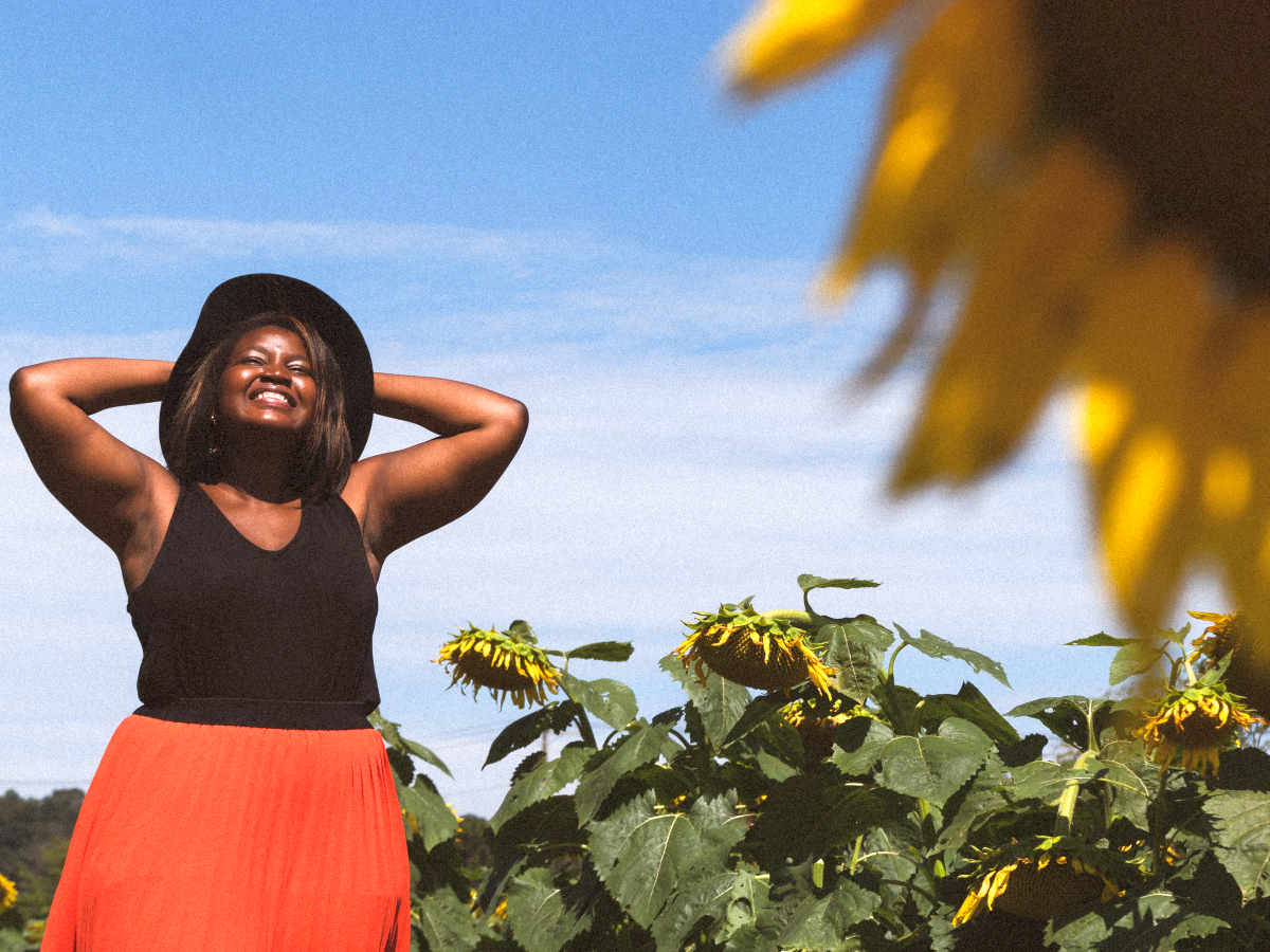 Woman in black tank top in sunflower field during daytime | HRT Hormone Replacement Therapy Frequently Asked Questions