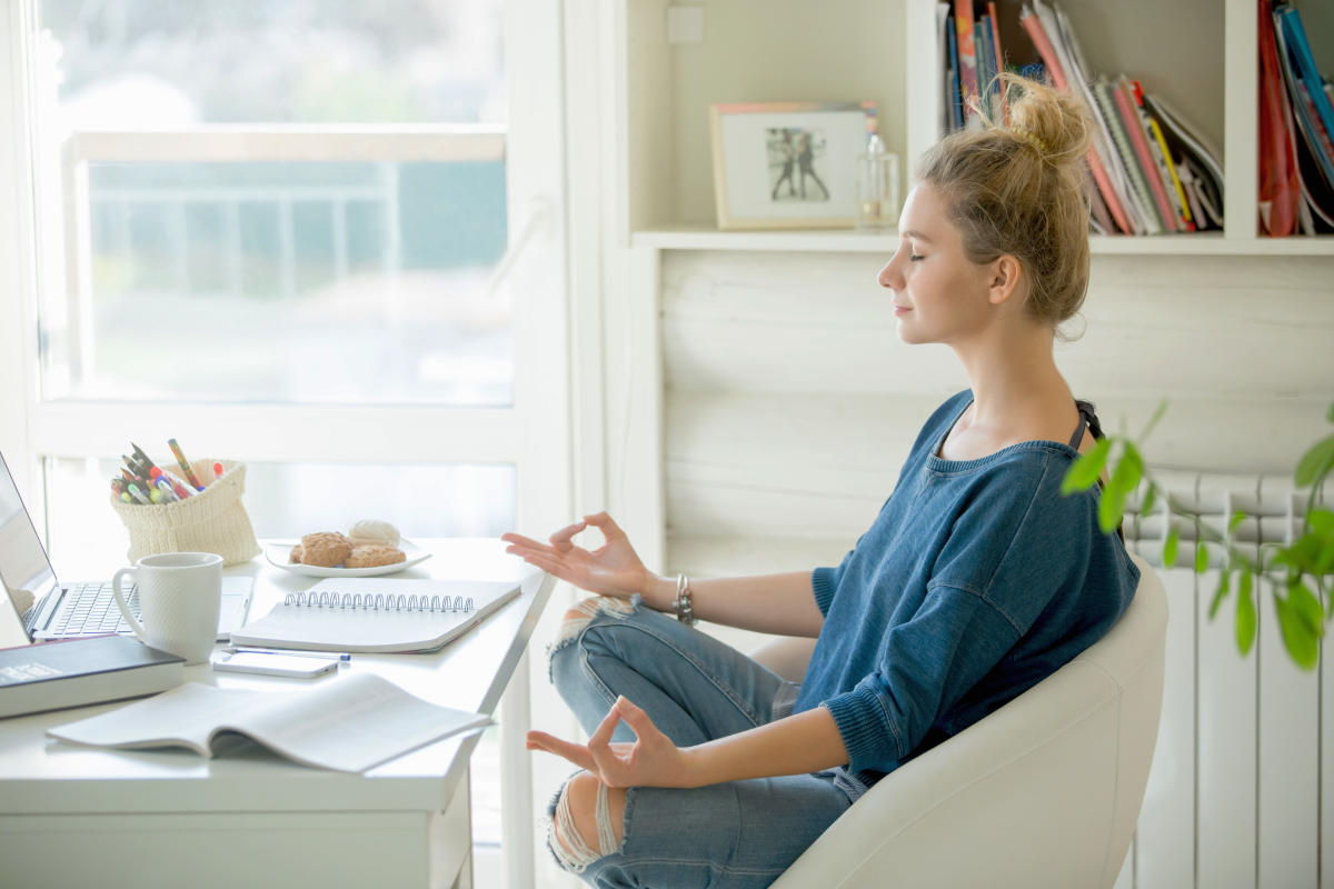 Attractive woman in a chair at the table with cup and laptop | Mindfulness For Beginners: Ways To Be Mindful Of The Present | teaching mindfulness