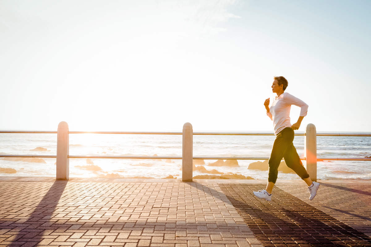 Sporty woman jogging at promenade on a sunny day | What Is Estrogen Dominance And What To Do About It? | estrogen dominance treatment