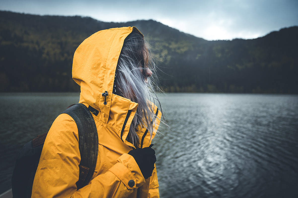 Outdoors adventure trek activity, hiker wearing yellow waterproof raincoat | Wilderness Survival | How To React In A Hiking Accident Before Help Arrives | survival skills training
