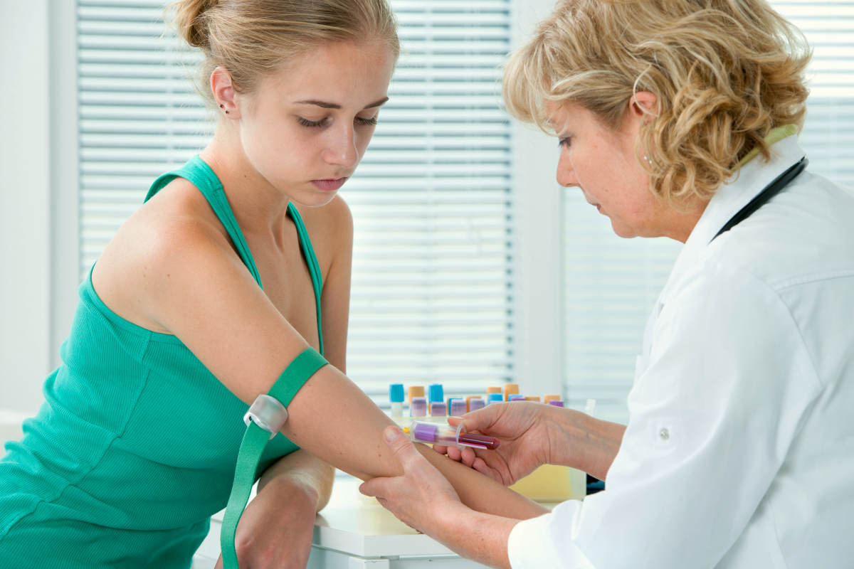 Nurse taking blood sample from patient at the doctors office | Tips To Maintain High Energy Levels On A Busy Workday | energy hacks