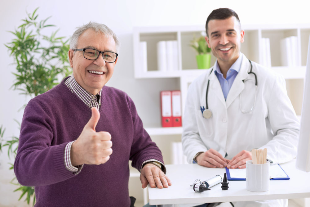 Satisfied old patient with success young doctor in office | Hormone Replacement Therapy For Men | Hormone Replacement Therapy Men | what does testosterone hrt do for men