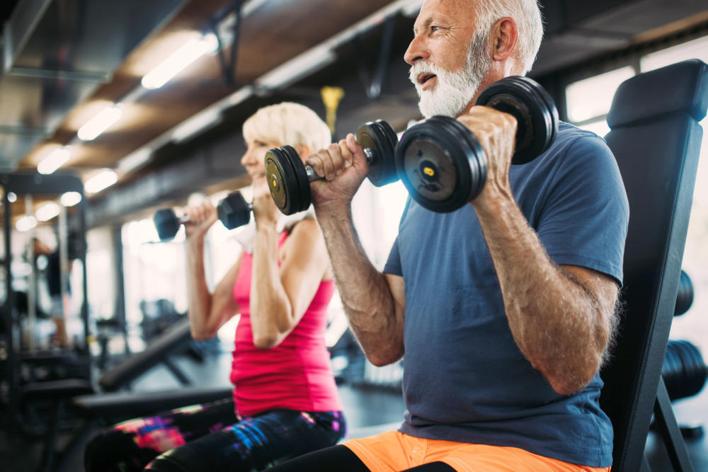 Senior fit man and woman doing exercises in gym to stay healthy | Hormone Replacement Therapy For Men | Hormone Replacement Therapy Men | hrt for men dosage