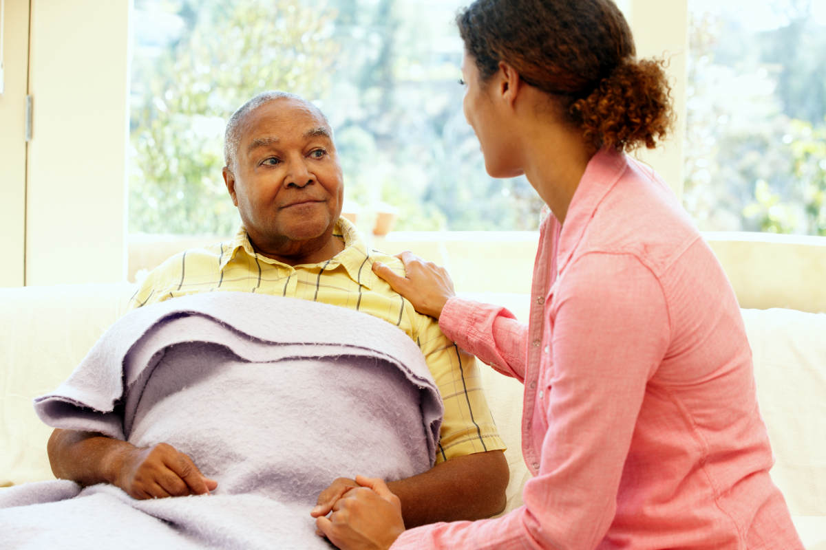 Woman looking after sick father | Inflammaging: How Aging And Inflammation Can Cause Age-Related Diseases (Case Study) | immunity theory of aging