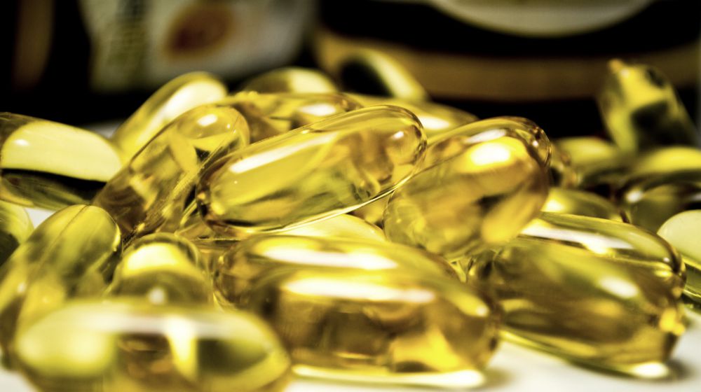 omega 3 pills on table | Natural Hyperthyroidism Treatments You Can Do At Home | hyperthyroidism treatment | hyperthyroidism symptoms