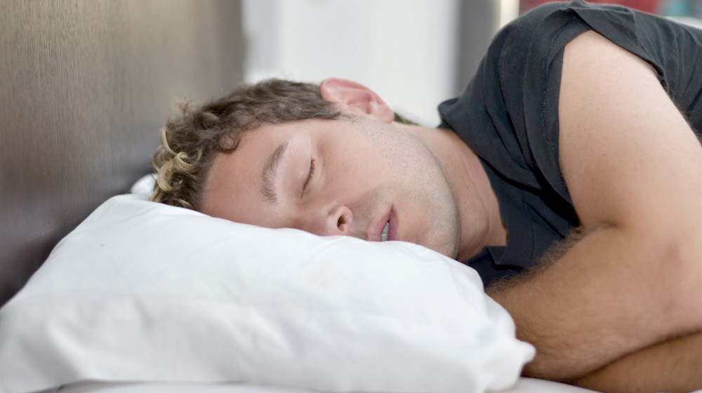 young handsome man sleeping | Headache From Lack of Sleep? | Why + How To Treat It | headache from lack of sleep | lack of sleep headache