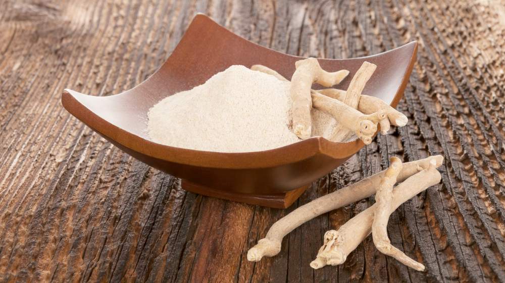 ashwagandha powder and roots on table | Natural Thyroid Medicine Alternatives To Levothyroxine | thyroid medicine | thyroid levels