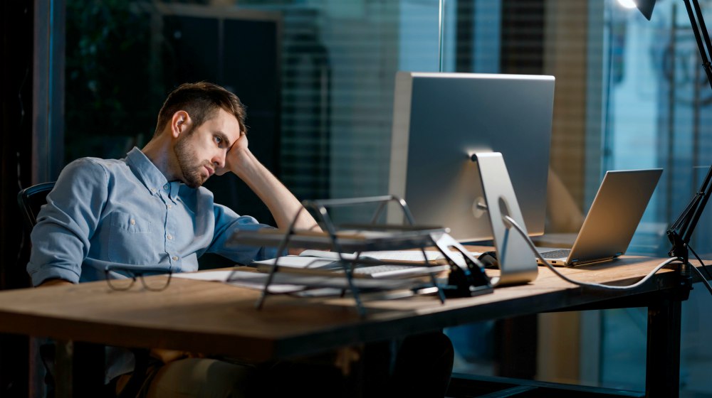 man looking fatigue while working | How Peptides Can Increase Energy Levels And Help People Focus | energy levels | peptides