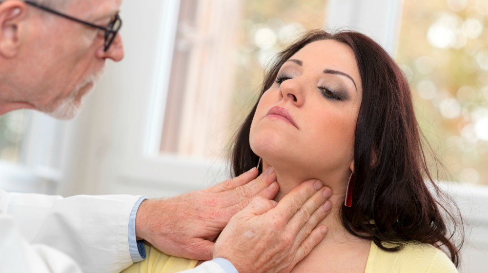 doctor checking thyroid of the patient | Thyroid Neck Check: A Step-By-Step Guide For Thyroid Disorders | thyroid neck check | hypothyroidism symptoms