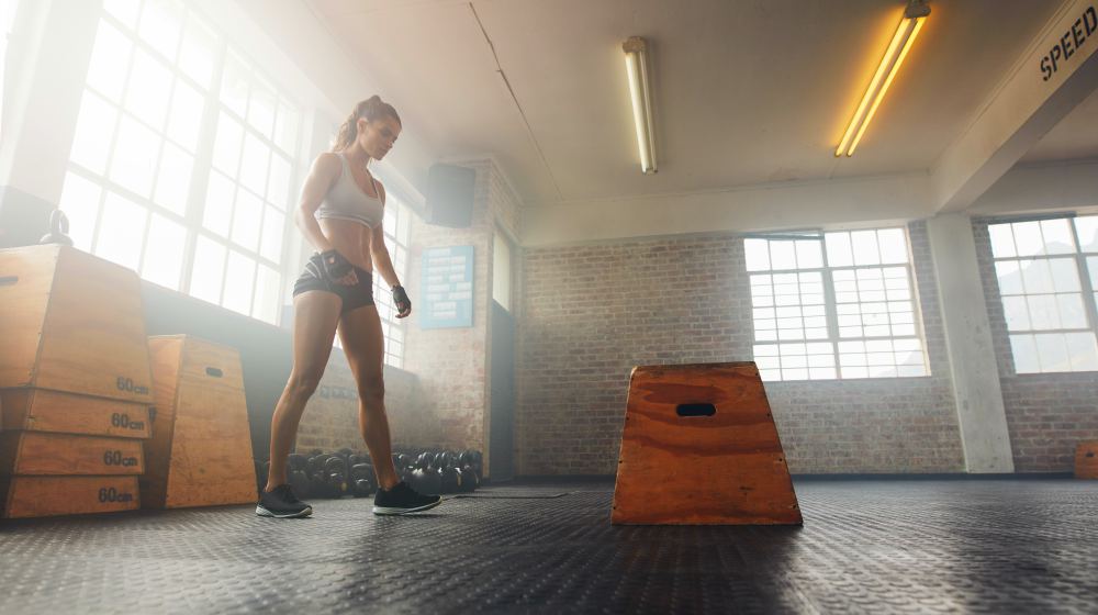 muscular woman working out | Stress And Thyroid | How They Affect The Body And How To Reduce It | stress and thyroid | thyroid gland